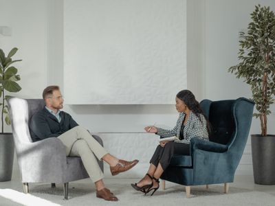Specialist doctor talking with patient in consultation