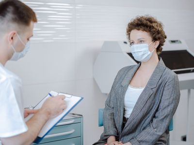 Doctor and patient having follow-up conversation in office